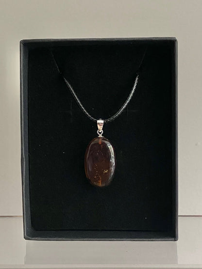 Burmite amber pendant with small fly (0.89") - FossilsAndMore